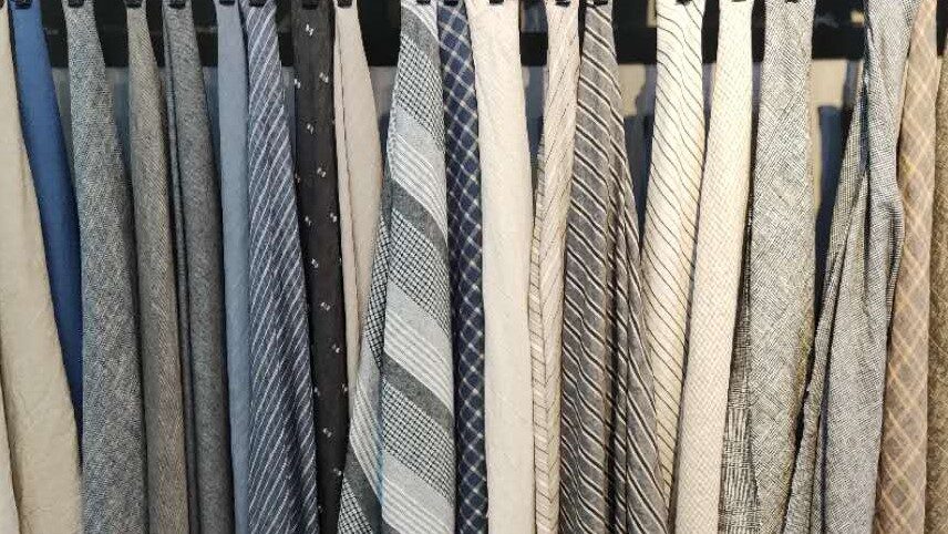 Linen fabrics hanging in our showroom